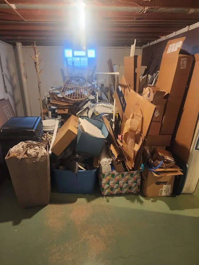 Roll-off dumpster container at job site for 2 Yard Dumpster Rental in Forest City